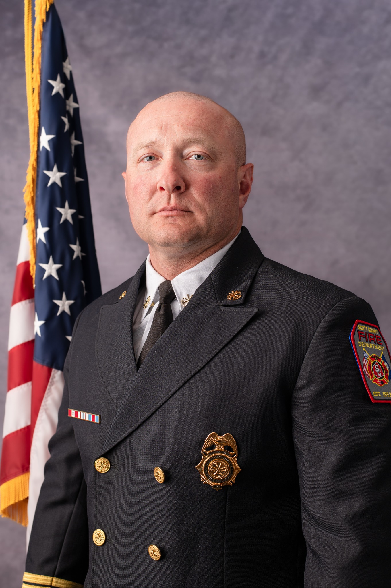 Assistant Chief Justin Baker in Scott County Fire Department dress uniform